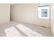 Well-lit bedroom with a window and neutral carpeting at 2325 S High St, Denver, CO 80210