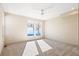 Bright bedroom with neutral walls and carpet, featuring two large windows at 2325 S High St, Denver, CO 80210