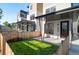 Modern townhome with private patio and fenced yard at 2325 S High St, Denver, CO 80210