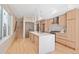Contemporary kitchen featuring an island and hardwood floors at 2325 S High St, Denver, CO 80210