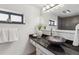 Elegant bathroom featuring a unique vessel sink, granite countertops, and modern fixtures at 1050 N Corona St # 316, Denver, CO 80218