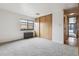 Carpeted bedroom with a large window and closet at 1050 N Corona St # 316, Denver, CO 80218