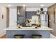 Well-lit kitchen featuring a center island, stainless steel appliances, and modern cabinets at 1050 N Corona St # 316, Denver, CO 80218