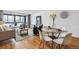 Cozy living room featuring hardwood floors, dining area, and comfortable seating at 1050 N Corona St # 316, Denver, CO 80218