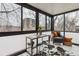 Bright sunroom featuring large windows, desk, and comfortable seating area with stylish accents at 1050 N Corona St # 316, Denver, CO 80218
