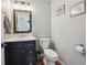 Stylish half bathroom with vanity, framed mirror and a clean, modern design at 543 Springvale Rd, Castle Rock, CO 80104