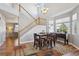 Open concept dining area with large windows and a staircase, creating a bright and airy space at 543 Springvale Rd, Castle Rock, CO 80104