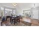 Bright dining room features large windows, hardwood floors, and a stylish chandelier at 543 Springvale Rd, Castle Rock, CO 80104