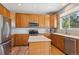 Modern kitchen with stainless appliances, center island and ample cabinet space at 543 Springvale Rd, Castle Rock, CO 80104