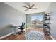 Well-lit office space with hardwood floors, ceiling fan, and a view of the neighborhood at 543 Springvale Rd, Castle Rock, CO 80104