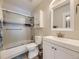 Clean bathroom with a shower/tub combo and updated vanity at 2630 S Xanadu Way # C, Aurora, CO 80014