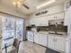 White kitchen with stainless steel appliances and granite counters at 2630 S Xanadu Way # C, Aurora, CO 80014