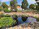 Landscaped pond with water lilies and rock features at 2630 S Xanadu Way # C, Aurora, CO 80014