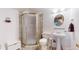 Basement bathroom with shower and pedestal sink at 6990 Orchard Ct, Arvada, CO 80007