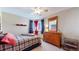 Bedroom with a twin-size bed, dresser, and ceiling fan at 6990 Orchard Ct, Arvada, CO 80007