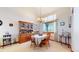 Dining room with a wooden hutch and a table set for four at 6990 Orchard Ct, Arvada, CO 80007