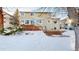 Two-story house exterior with snowy backyard and deck at 6990 Orchard Ct, Arvada, CO 80007