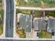 Aerial view of the home showing roof, driveway, fenced yard, and landscaping at 12606 S Sopris Creek Dr, Parker, CO 80134
