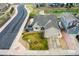 Aerial view of a house with fenced backyard, landscaped yard, and an attached garage at 12606 S Sopris Creek Dr, Parker, CO 80134