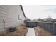 Backyard features a hot tub, gravel landscaping, and a privacy fence at 12606 S Sopris Creek Dr, Parker, CO 80134