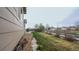 Spacious backyard with a mix of green lawn and rock landscaping, offering privacy and curb appeal at 12606 S Sopris Creek Dr, Parker, CO 80134