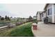Backyard with patio, a grill, and view of green space and other homes at 12606 S Sopris Creek Dr, Parker, CO 80134