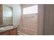 Clean bathroom with a bathtub, shower, and a vanity sink, providing a functional space at 12606 S Sopris Creek Dr, Parker, CO 80134