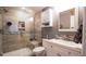 Modern bathroom with glass shower, tiled walls, and updated vanity at 12606 S Sopris Creek Dr, Parker, CO 80134
