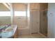 Bathroom featuring double sinks, soaking tub, and separate shower at 12606 S Sopris Creek Dr, Parker, CO 80134