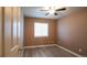 Cozy bedroom featuring hardwood floors and a window at 12606 S Sopris Creek Dr, Parker, CO 80134