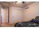 Bedroom featuring neutral walls, ceiling fan, and large closet with double doors at 12606 S Sopris Creek Dr, Parker, CO 80134
