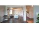 Open dining room area with hardwood floors, natural light, and a view of the staircase at 12606 S Sopris Creek Dr, Parker, CO 80134
