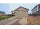 Charming home with a two-car garage, well-maintained lawn, and beautiful brick accents at 12606 S Sopris Creek Dr, Parker, CO 80134