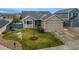 Beautiful single-Gathering home featuring a well-manicured lawn, attached garage, and inviting curb appeal at 12606 S Sopris Creek Dr, Parker, CO 80134