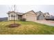 Exterior of a well-maintained one-story home with a two-car garage and manicured lawn at 12606 S Sopris Creek Dr, Parker, CO 80134