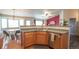 Eat-in kitchen view showcasing modern appliances, wood floors, and an adjacent dining area with abundant light at 12606 S Sopris Creek Dr, Parker, CO 80134