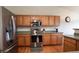 The well-equipped kitchen features stainless steel appliances and wood cabinetry at 12606 S Sopris Creek Dr, Parker, CO 80134