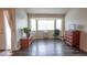 View of empty living room space featuring wood floors and large window at 12606 S Sopris Creek Dr, Parker, CO 80134