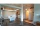 Open living room with hardwood floors, modern lighting and an open concept design at 12606 S Sopris Creek Dr, Parker, CO 80134