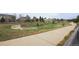 Picturesque neighborhood view showcasing the walking path and several homes in a suburban community at 12606 S Sopris Creek Dr, Parker, CO 80134