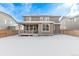 Exterior rear view of a two story home showing the backyard, patio and fencing at 14769 Dahlia St, Thornton, CO 80602