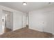 An empty bedroom offers neutral colors and carpet flooring at 14769 Dahlia St, Thornton, CO 80602