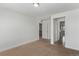 Neutral bedroom featuring carpet flooring, white walls, and multiple entryways at 14769 Dahlia St, Thornton, CO 80602