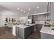 Open concept kitchen with a large island, stainless steel appliances, and gray cabinets at 14769 Dahlia St, Thornton, CO 80602