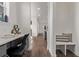 Mud room with a built-in desk, storage bench, and hardwood floors connecting to the rest of the house at 14769 Dahlia St, Thornton, CO 80602