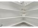 Pantry featuring white shelving with decorative jars and containers at 14769 Dahlia St, Thornton, CO 80602
