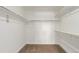 Spacious walk-in closet with ample hanging space, shelving, and carpeted floor at 14769 Dahlia St, Thornton, CO 80602