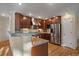 Modern kitchen with stainless steel appliances and granite countertops at 13471 Cascade St, Broomfield, CO 80020