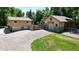 Aerial view showing house, detached barn, and gravel driveway at 7722 W 1St Pl, Lakewood, CO 80226