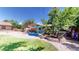 Landscaped backyard oasis featuring a deck and pergola at 7722 W 1St Pl, Lakewood, CO 80226